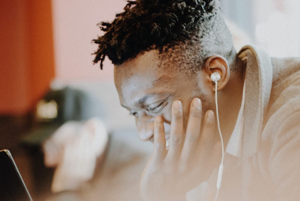 Man enjoying reading on computer